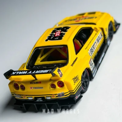 ماکت ماشین فلزی نیسان اسکای لاین R34 سوپر سیلوئت لیبرتی واک زرد | Nissan LB-ER34 Super Silhouette Skyline Sport Yellow | MINI GT 1182 | مقیاس 1:64 - Image 6
