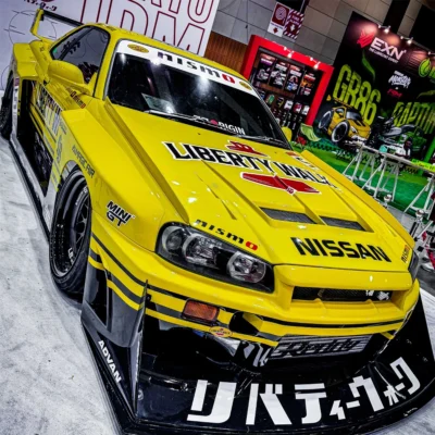 ماکت ماشین فلزی نیسان اسکای لاین R34 سوپر سیلوئت لیبرتی واک زرد | Nissan LB-ER34 Super Silhouette Skyline Sport Yellow | MINI GT 1182 | مقیاس 1:64 - Image 8